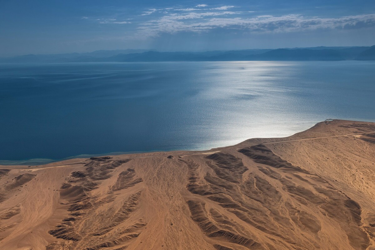 The building site for Neom: a futuristic city where the desert meets the Red Sea, with views of Egypt across the water, and plans for a giant bridge to cross the span