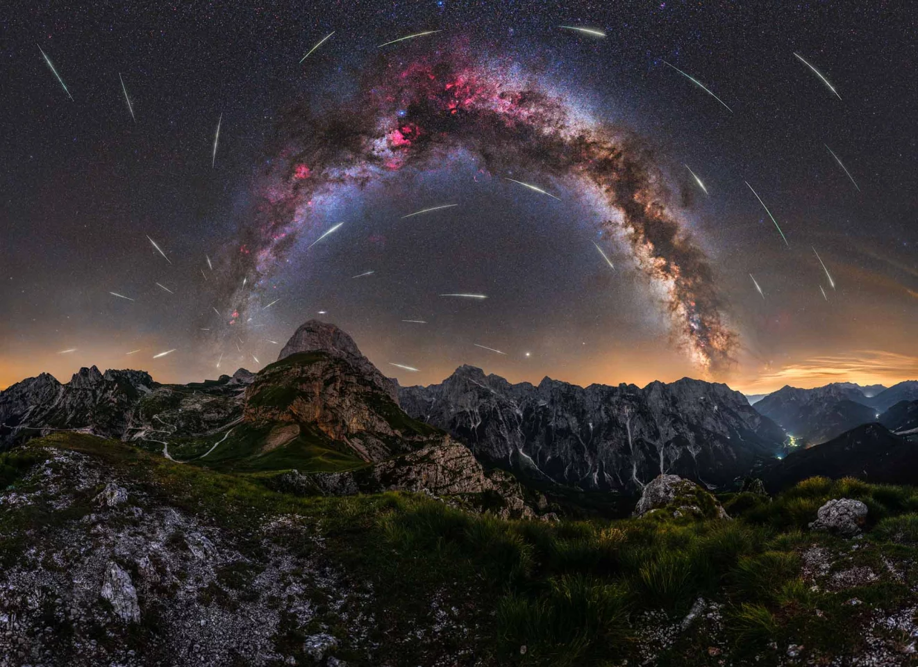 Perseid Meteor Shower on Mangart Saddle. Taken among the Julian Alps in Slovenia, the detail of the Milky Way is adorned with a sprinkle of light from a meteor shower
