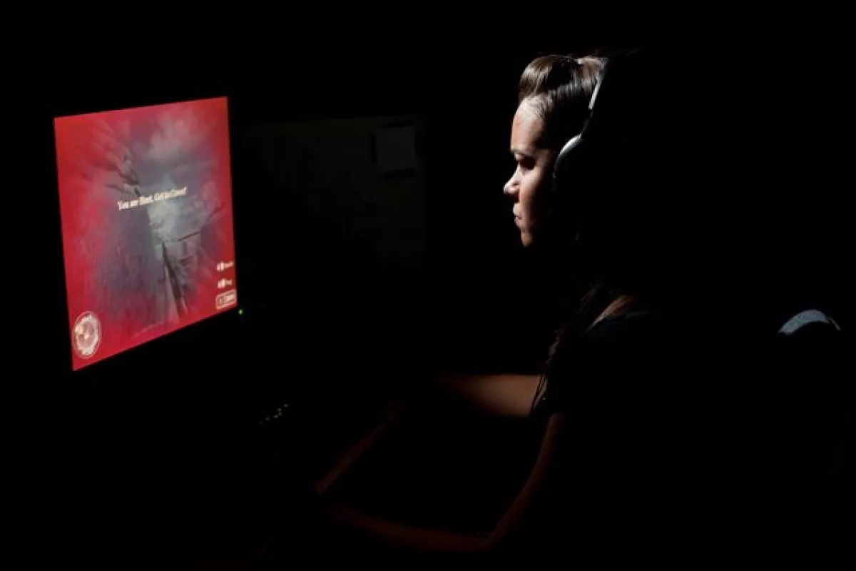 One of the test subjects playing an action video game (Photo: J. Adam Fenster, University of Rochester)