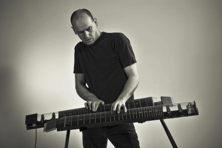 The Kelstone 9-string instrument can be played using both hands, like a piano