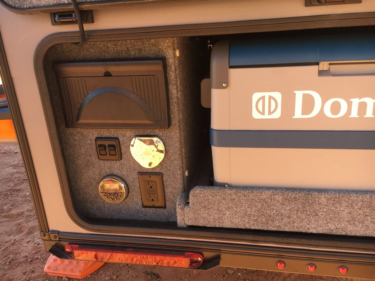 Instead of the full tailgate galley you usually see on a teardrop trailer, the Off-Axis rear houses fridge/cooler storage, the water tank and power