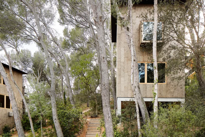 Two Cork Houses by Emiliano López Mónica Rivera Arquitectos both feature an impressive facade made from cork