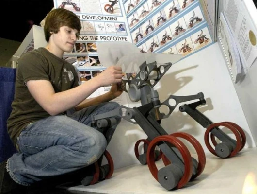 Christopher Olsen, a Senior at Valley Central High School in Montgomery, New York, with his project, an all-terrain, omnidirectional, stair-climbing wheelchair