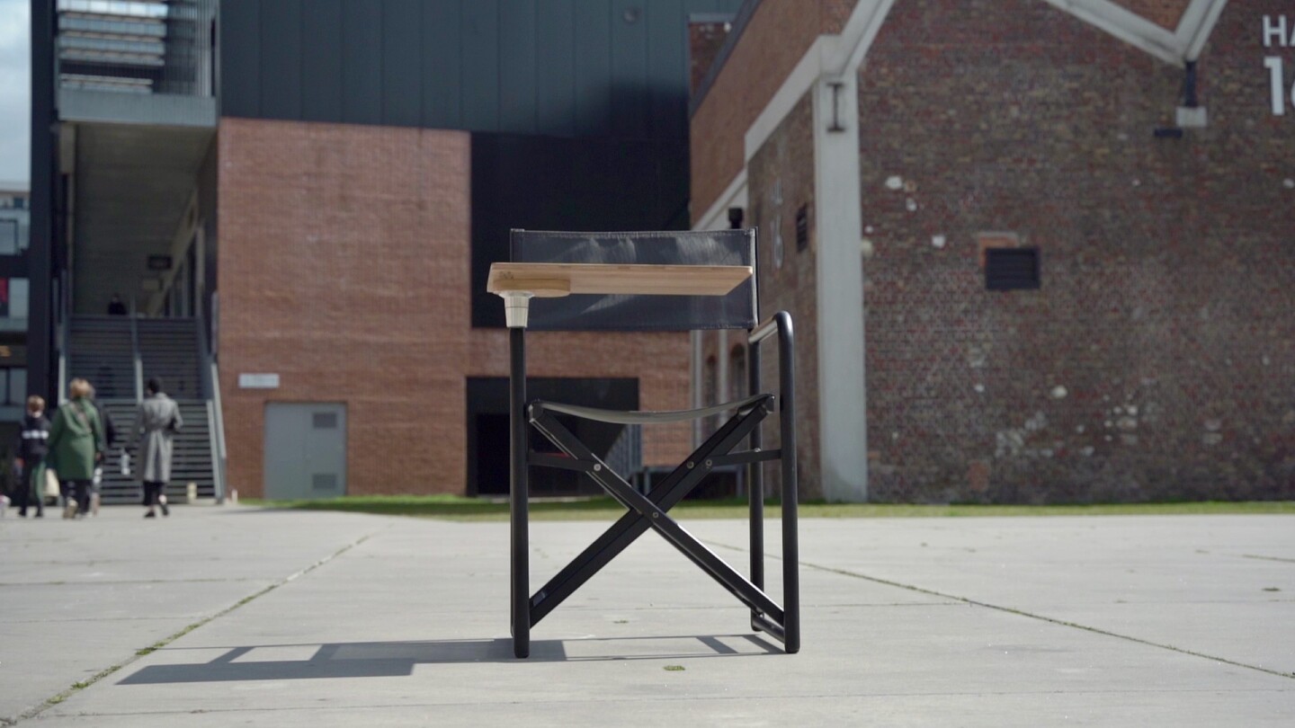 While other employees go indoors, the chAIR user gets things done outside