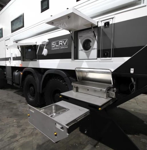 Outdoor-access washing machine, TV and kitchen