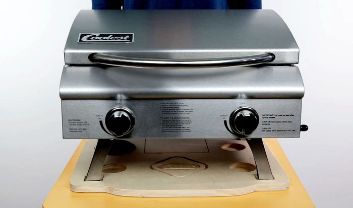 The available grill fits into the top of the Coolest for easy transport
