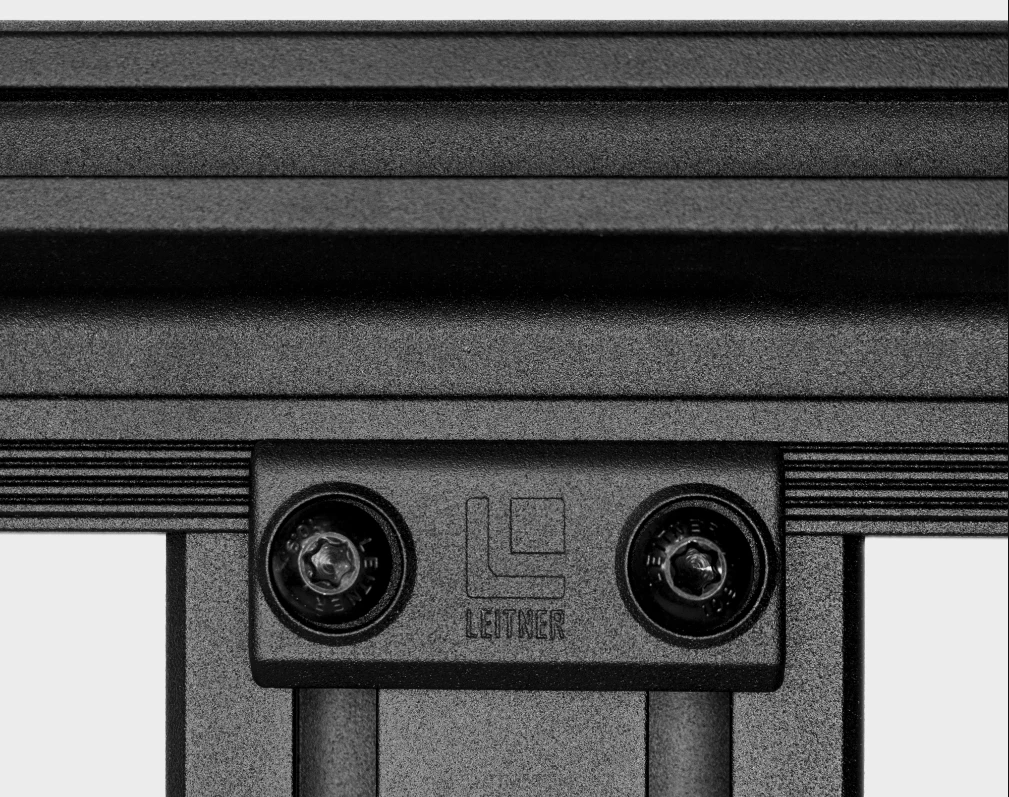 Loosen the two bolts on each end of the crossbar and they can be moved anywhere and tightened back down into the grooved frame