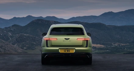 The rear end features smooth curves and carbon fiber