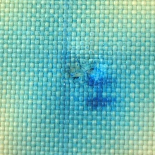 The back of Kevlar fabric after being stabbed with a knife