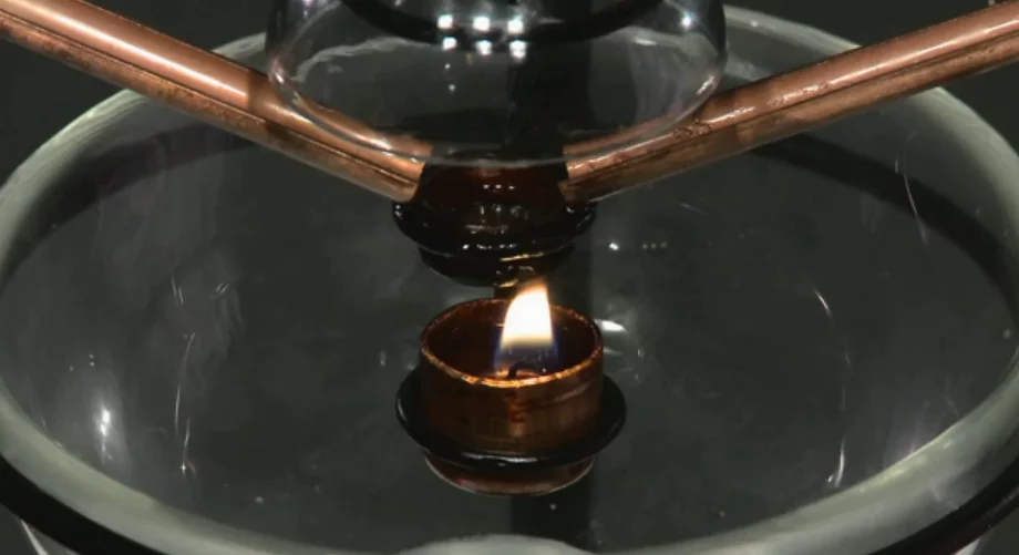 Oncle Sam uses a tea-light candle to pop one popcorn at a time