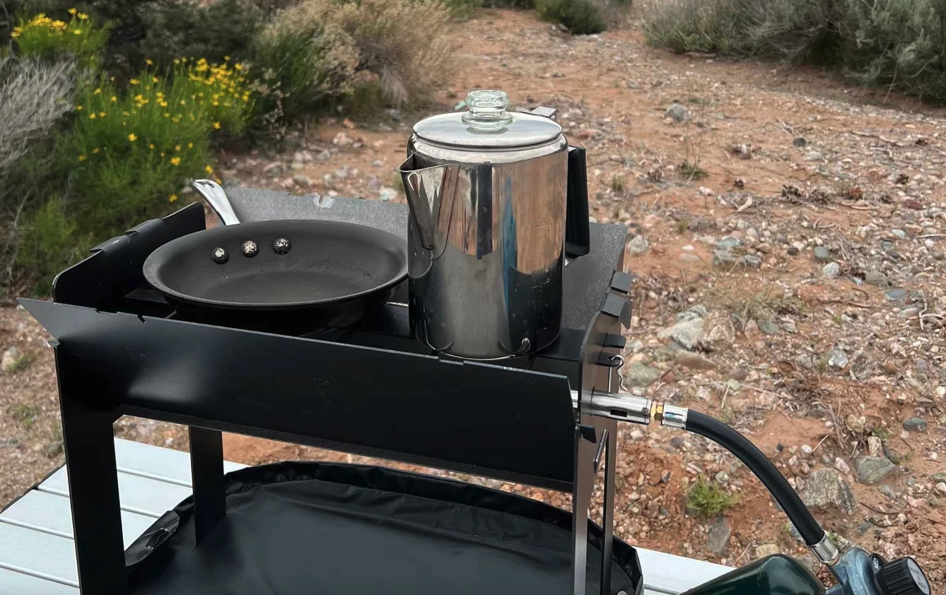 A simple accessory bar sits right over the propane burner, turning the G1 into a camp stove