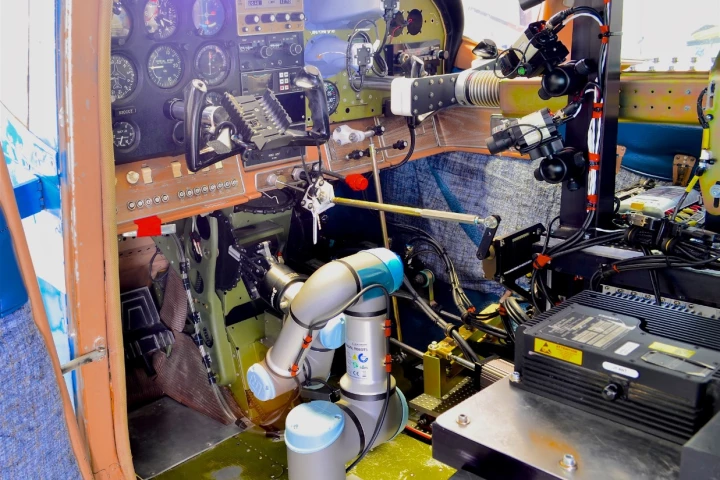 A cockpit view of ROBOpilot attached to seat rails with no permanent modifications to the aircraft