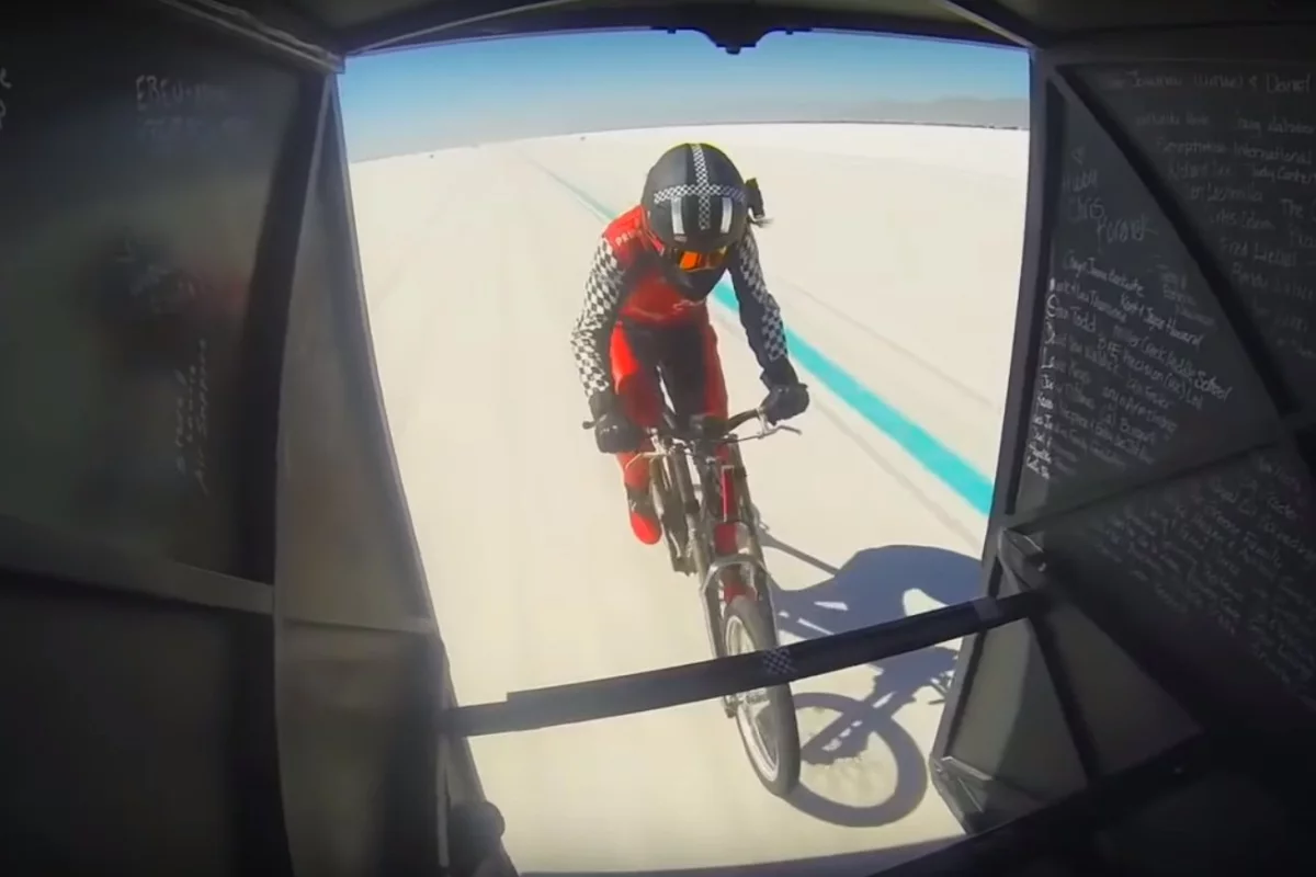 Denise Mueller-Korenek tucked in behind a dragster driven by Shea Holbrook during the motor-paced record run on Sunday September 16, 2018