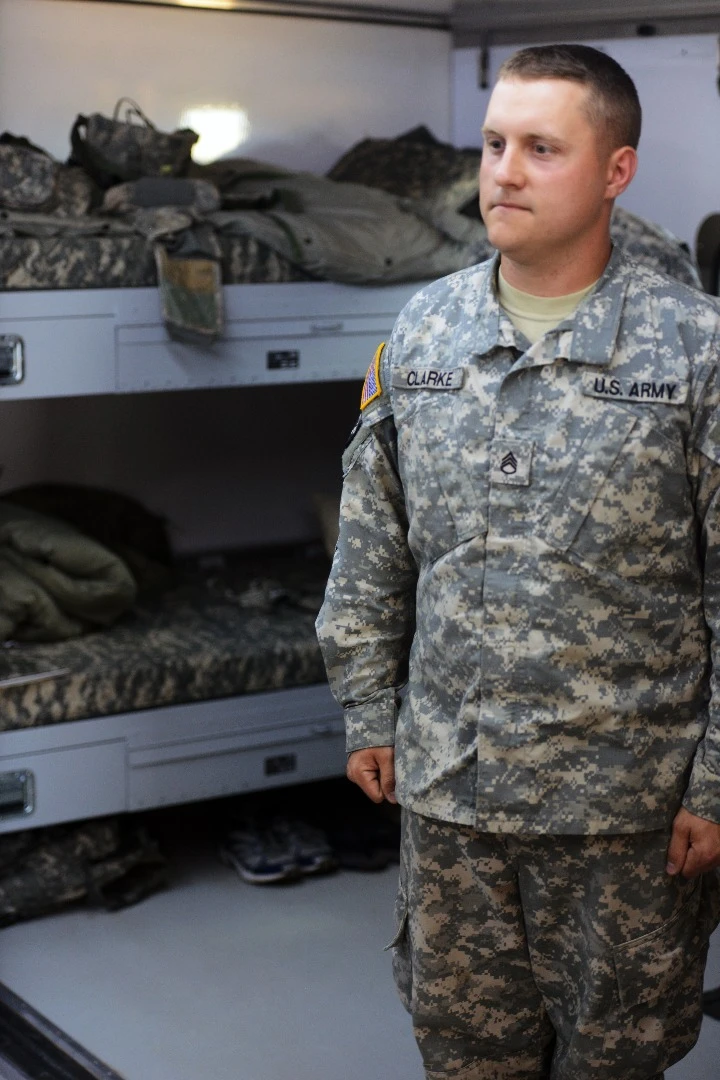 Staff Seargent James Clarke, from the 563rd Quartermaster Company, shows his Force Provider System air-conditioned living quarters
