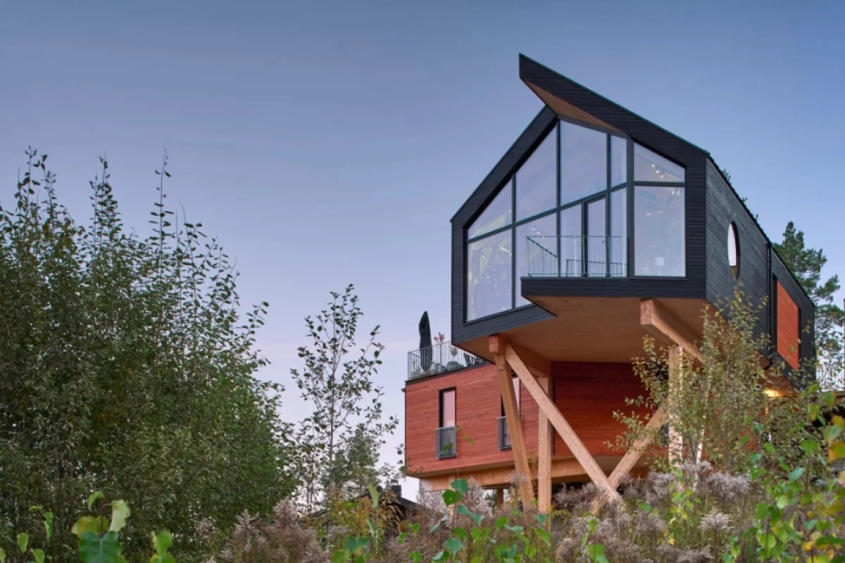 Large black-framed windows make the most of the magnificent surrounding views