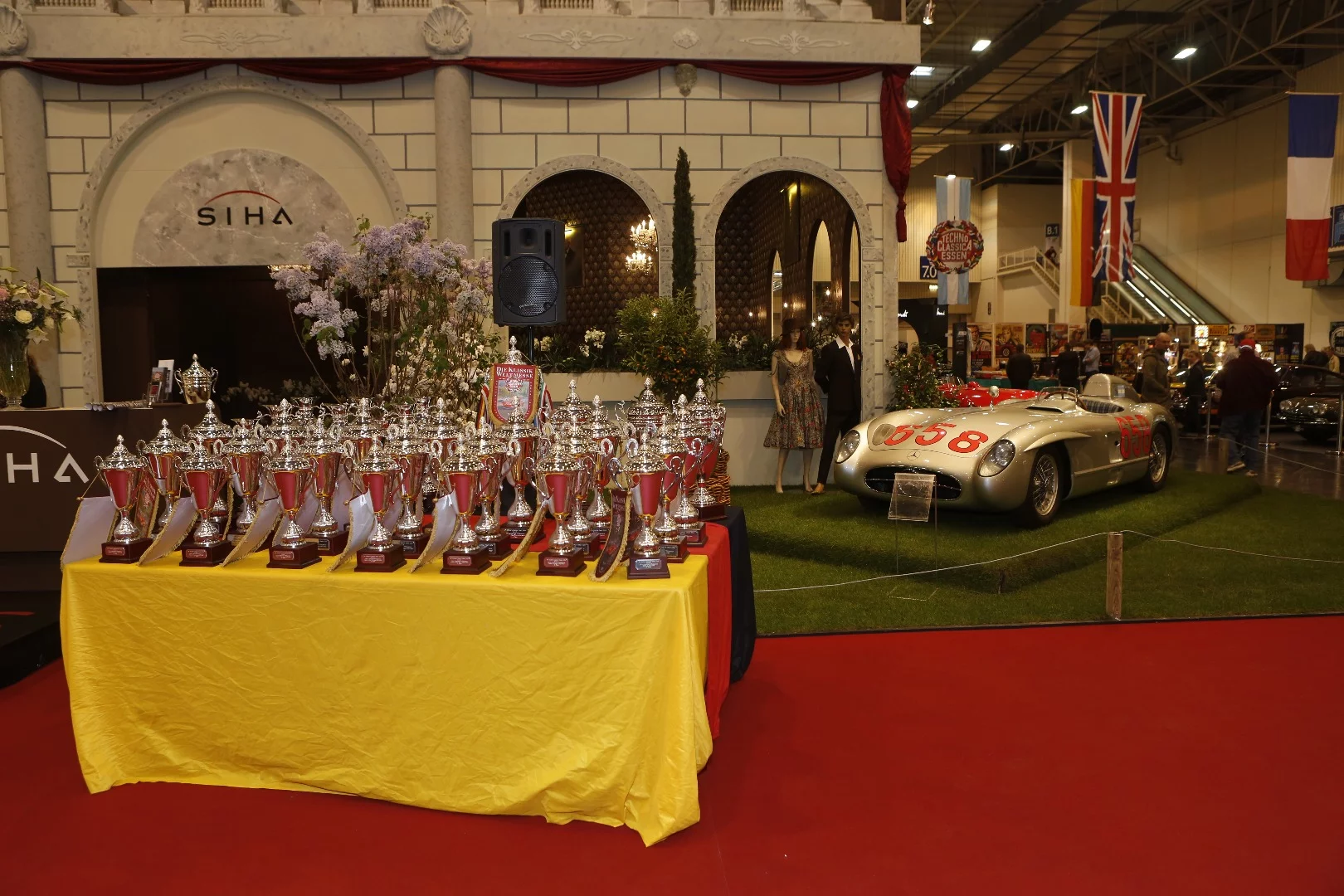 Fangio's 300 SLR and the trophies await the judges decision.