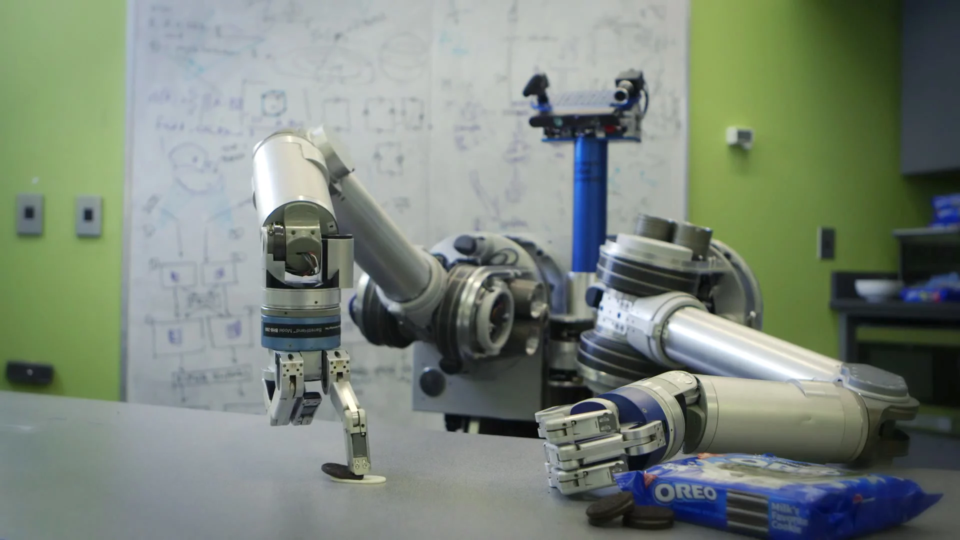 HERB tries to separate the cookie from the creme by smearing it on a table – bad robot!