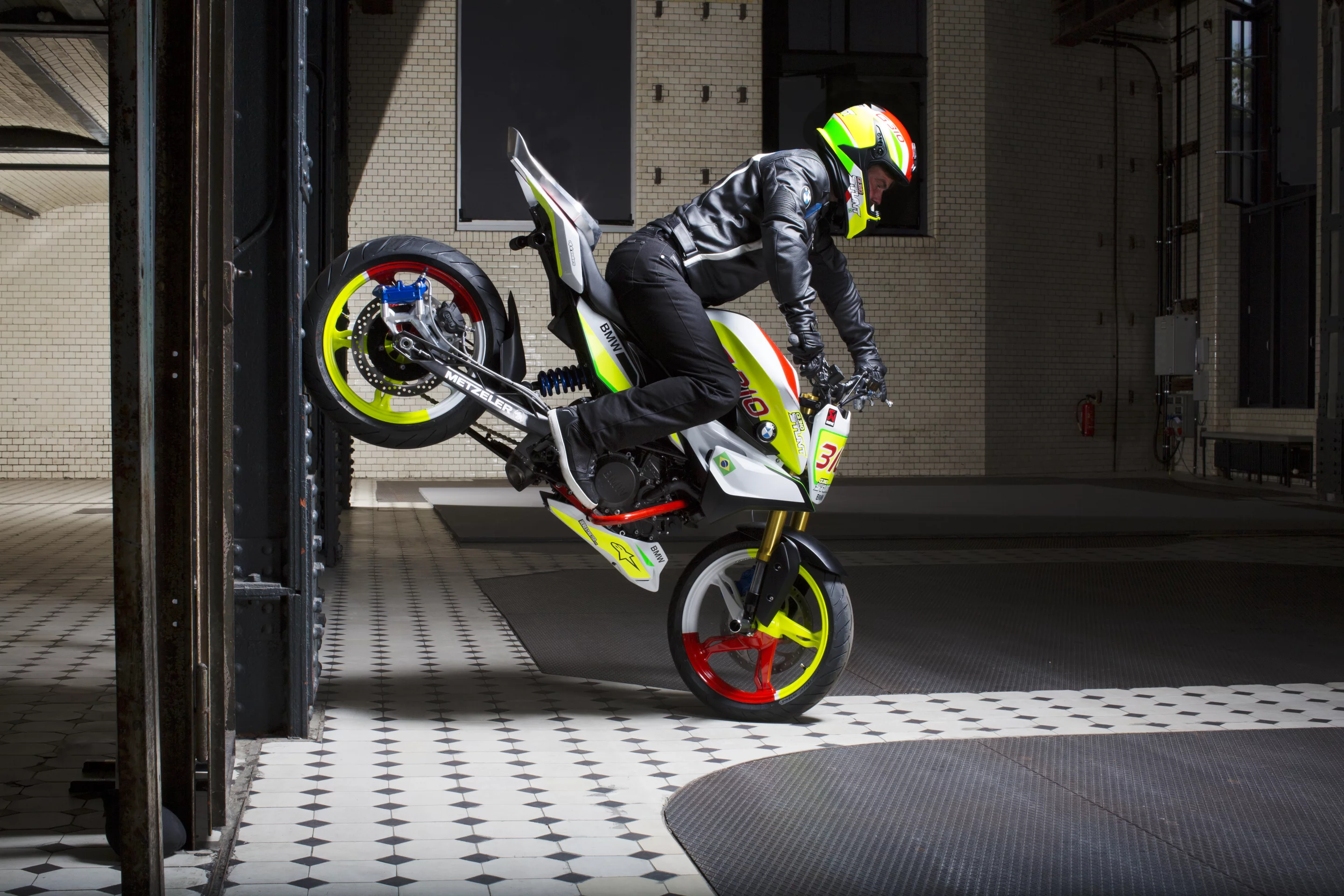 Christian Pfeiffer rides the BMW Concept Stunt G 310: stoppie wall stall