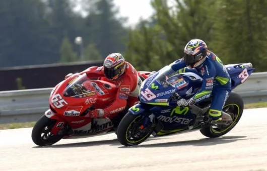 Capirossi and Melandri fight out what they thought was third place