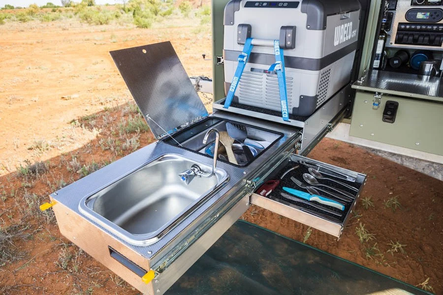 Slide out sink and storage on the Patriot TH610