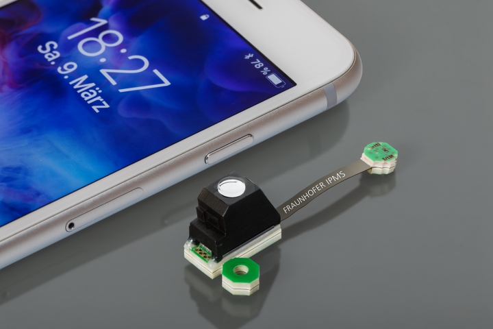 Small sensor on table next to cell phone