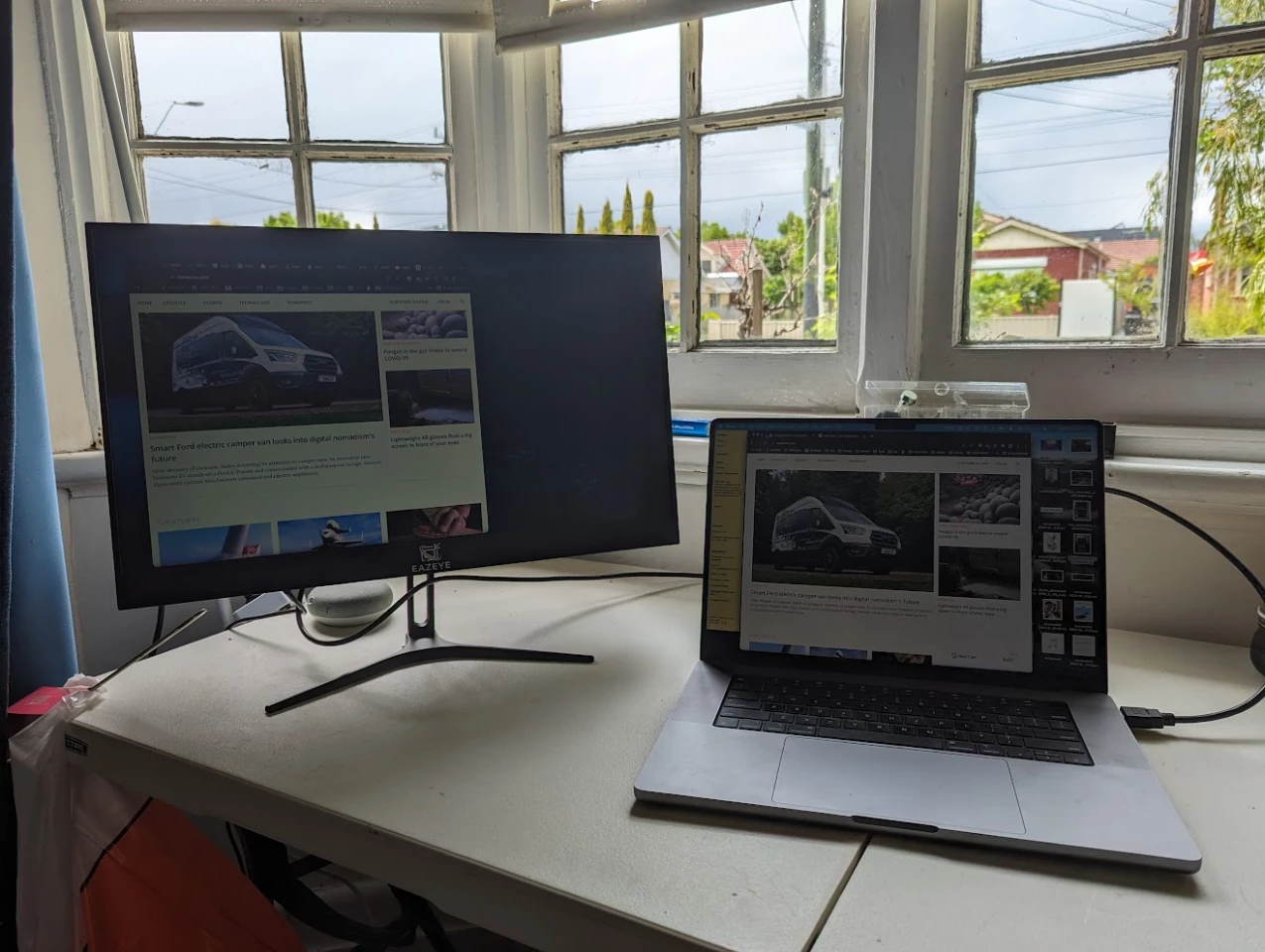 The bright light outdoors doesn't help; you really need to get your blinds adjusted perfectly (Macbook is adjusted to ~10-15% brightness_