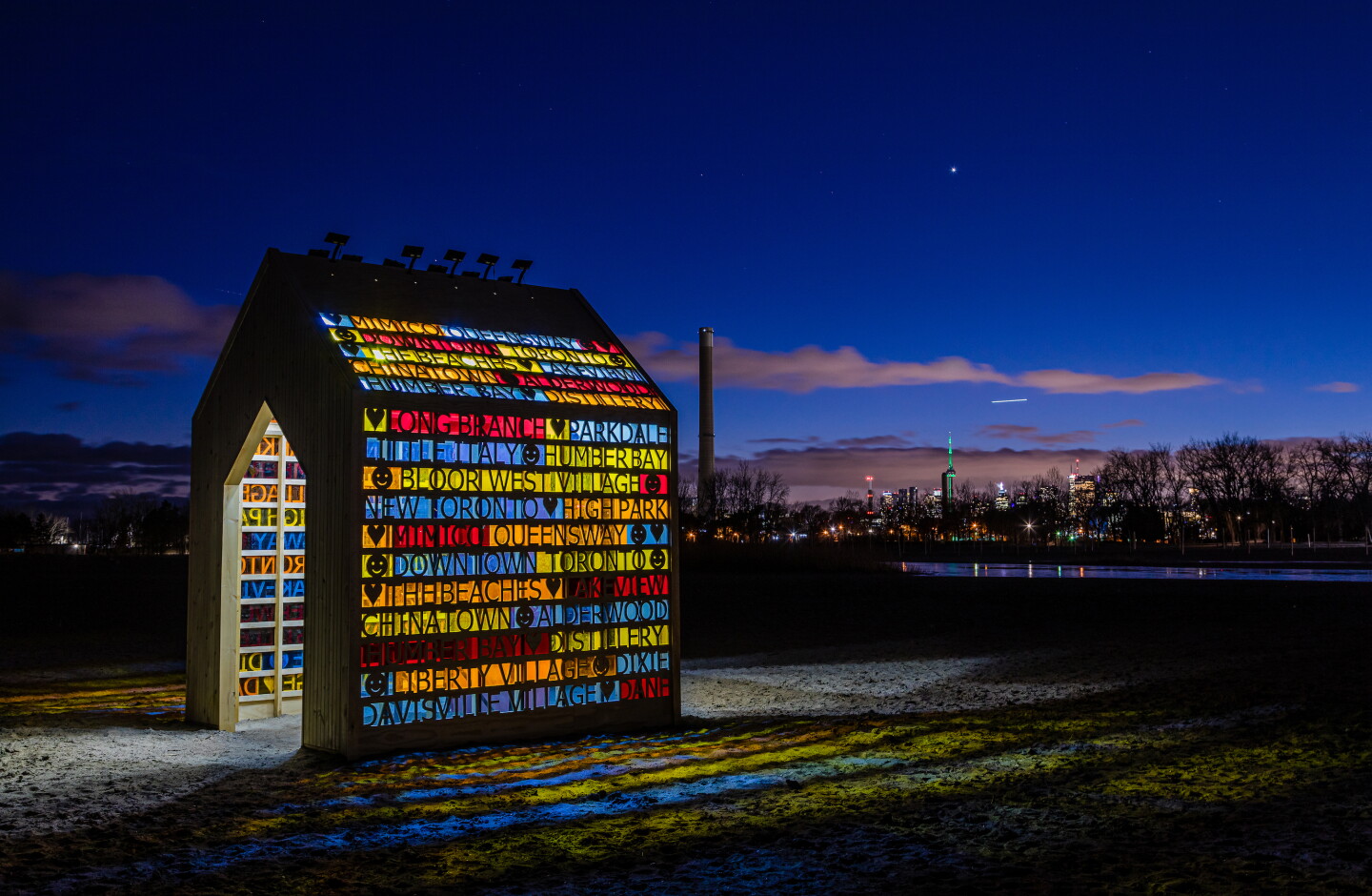 the (Home) was designed by Scott Shields Architects in Canada.A simple pavilion-like structure, with brightly colored walls, designed to offer an ever-changing experience, day or night