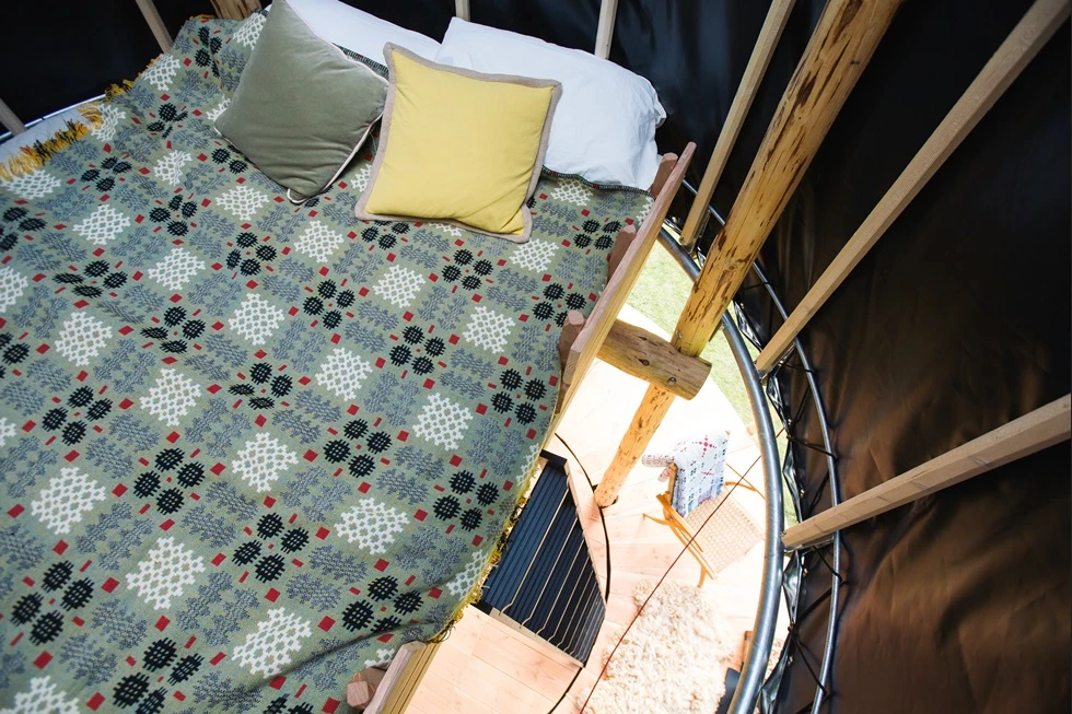 Black Hat's king-size bed sits in the top of the hat with a view of the stars through the roof dome