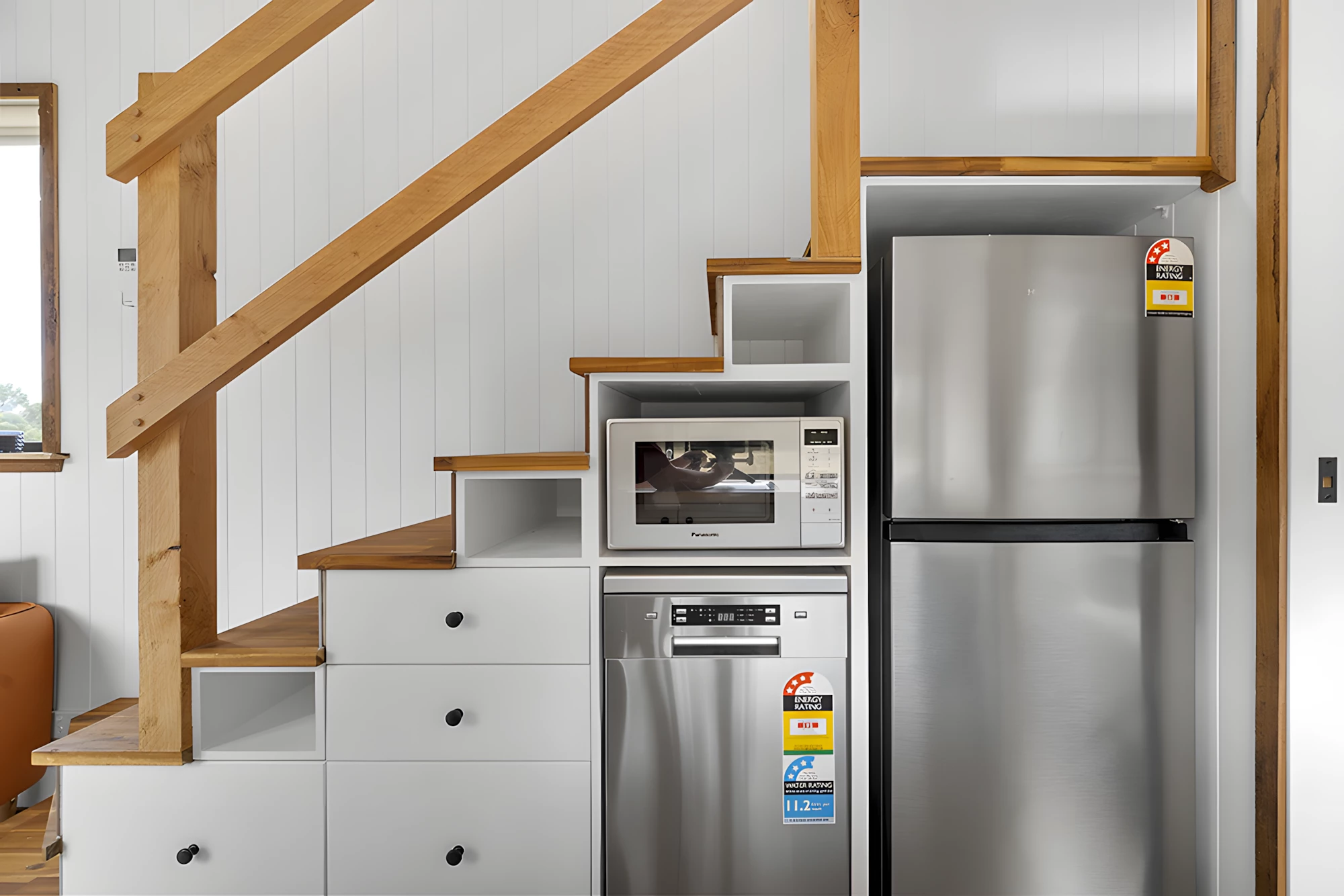 The Grevillea's kitchen includes a dishwasher, which is tucked into the storage-integrated staircase