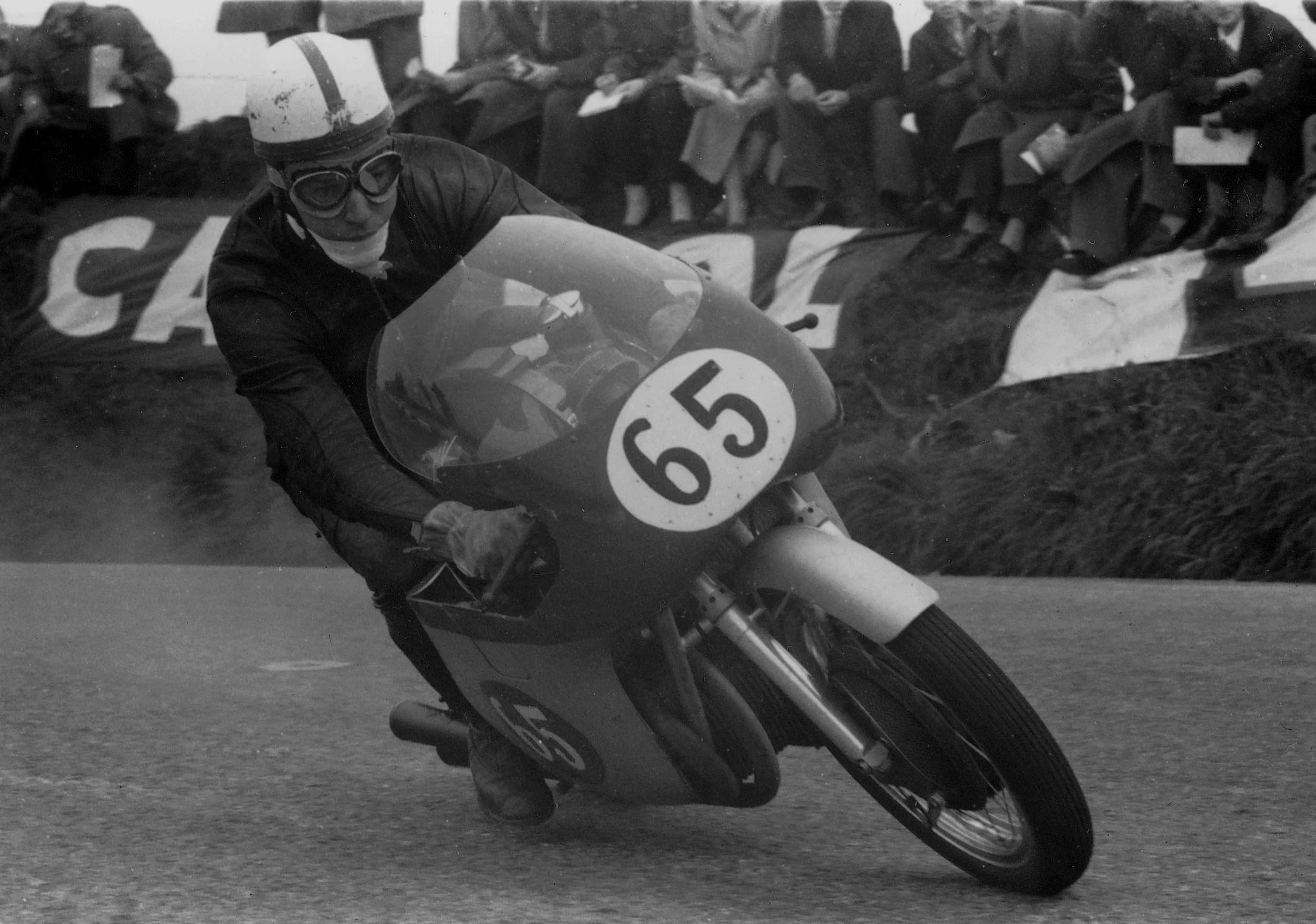 John Surtees, the works rider for MV Agusta in 1957, also lapped at 100 mph the day McIntyre became the first man to break the ton - he won the next three years before heading to Formula One car racing
