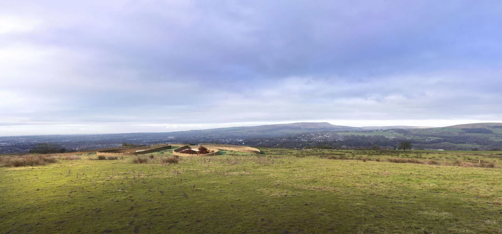 The Bolton Eco house is buried into the landscape and has six exposed nodes all pointing towards the underground centre of the home