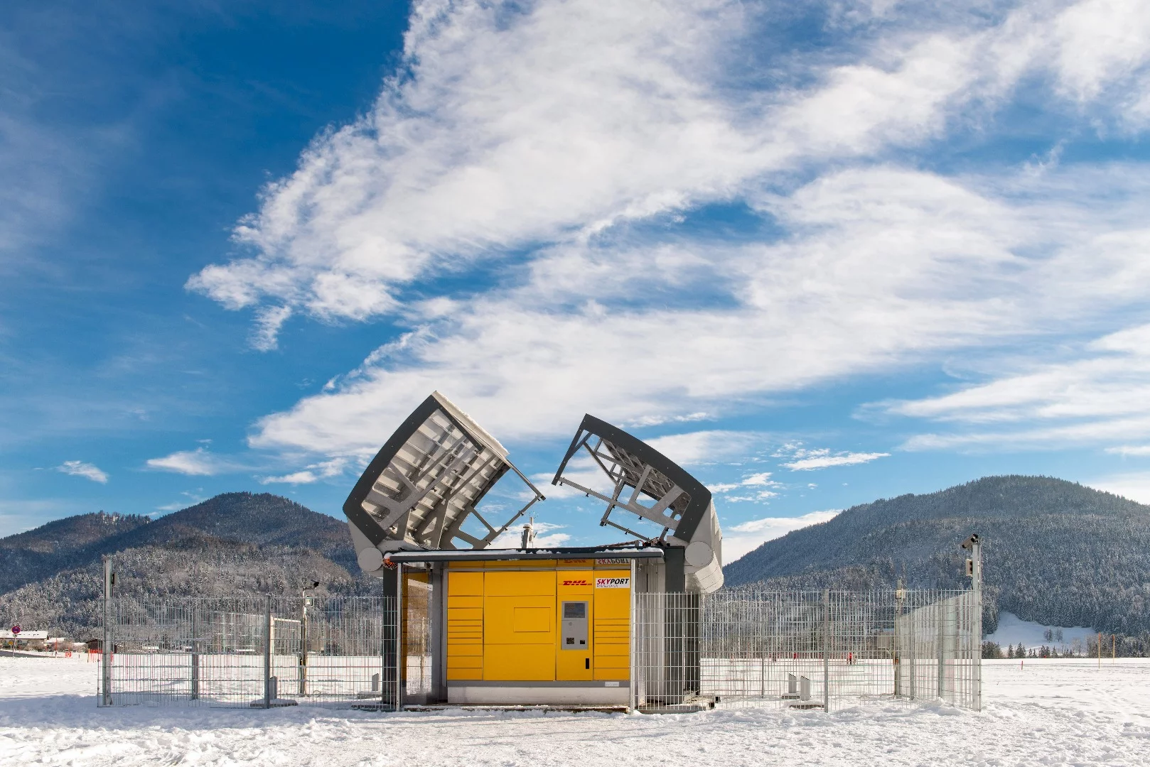 When a package is inserted into the Packstation, the roof opens to allow the drone a speedy exit