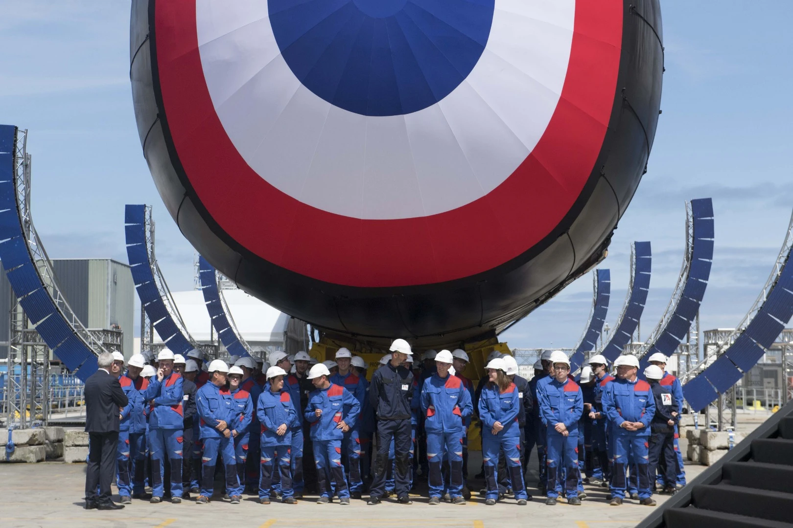 Naval Group workers show the scale of Suffren