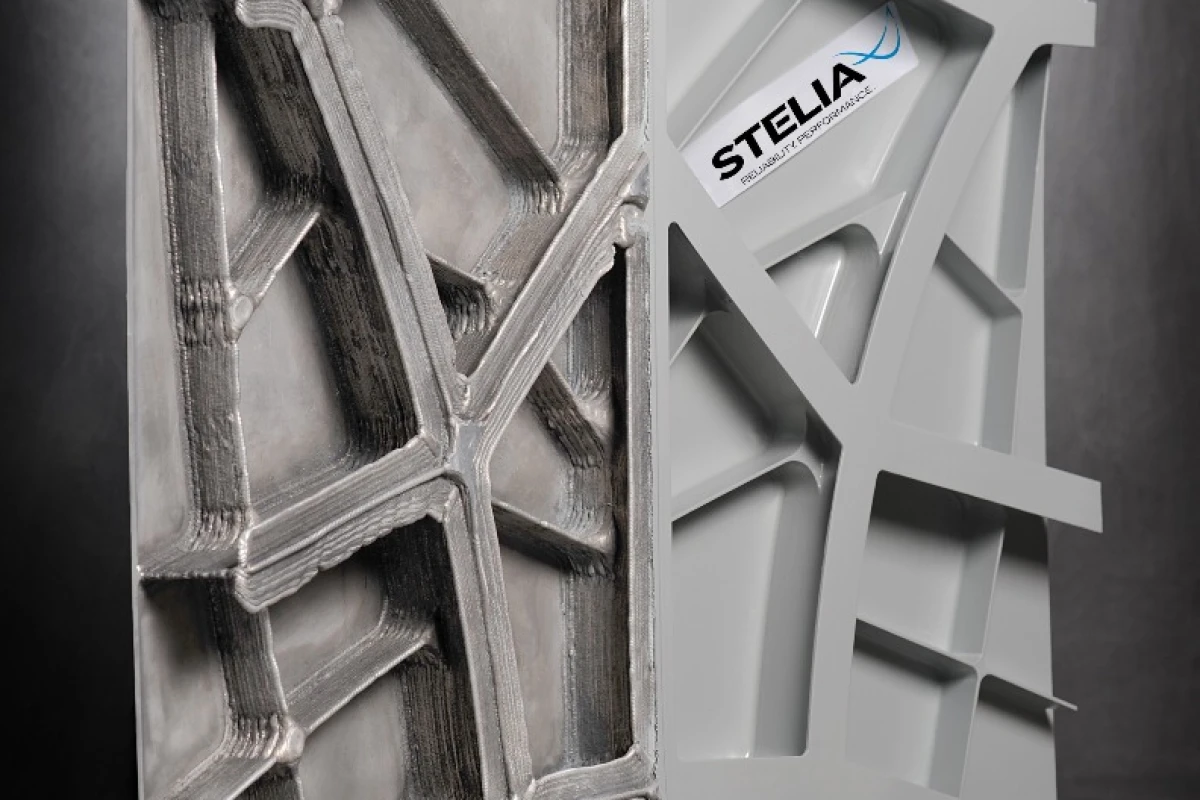 The printed fuselage panel showing the rough printed surface on the left and the polished and painted surface on the right
