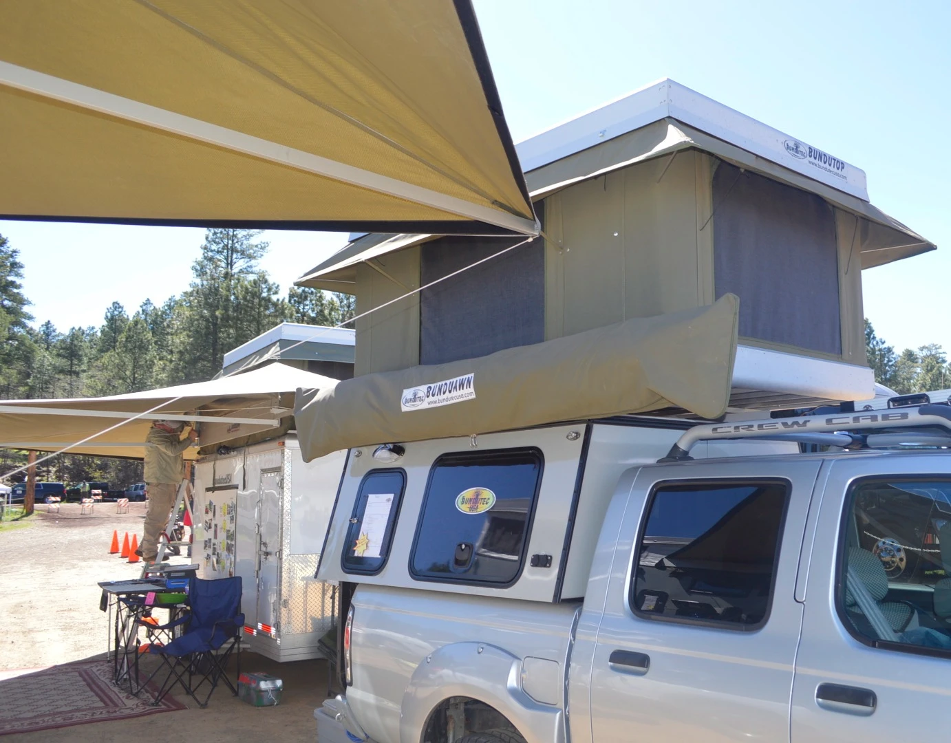 The model on show at Overland Expo includes a BunduTop electric-open tent and BunduAwn awning