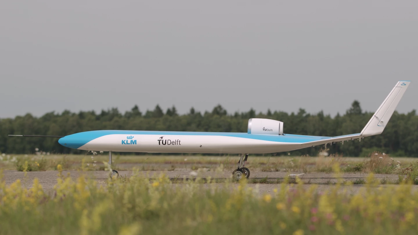 A scale model of the Flying V airplane on the runway