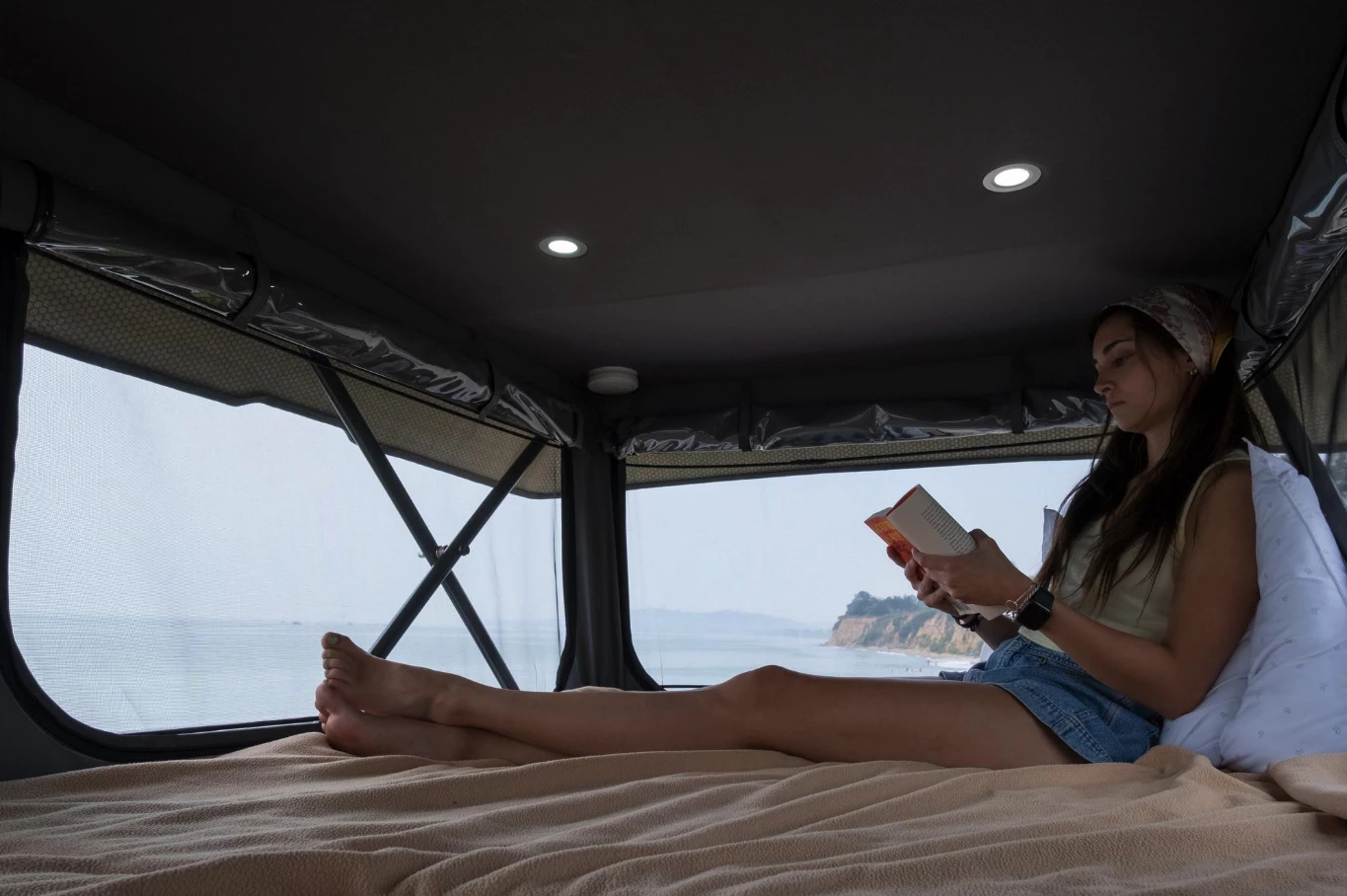 Enjoying the roof bed and its large windows