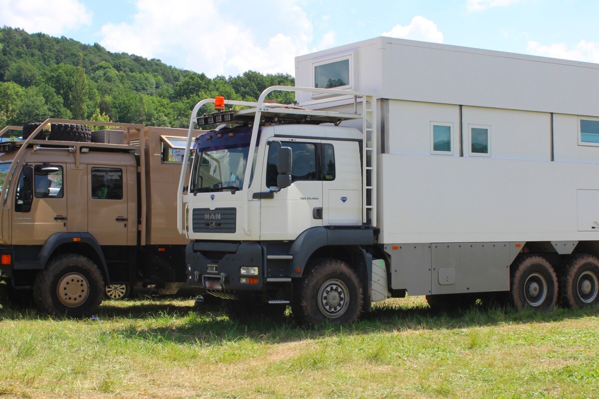 A pair of burly MANs (Men?) in the camp area at Abenteuer & Allrad 2018