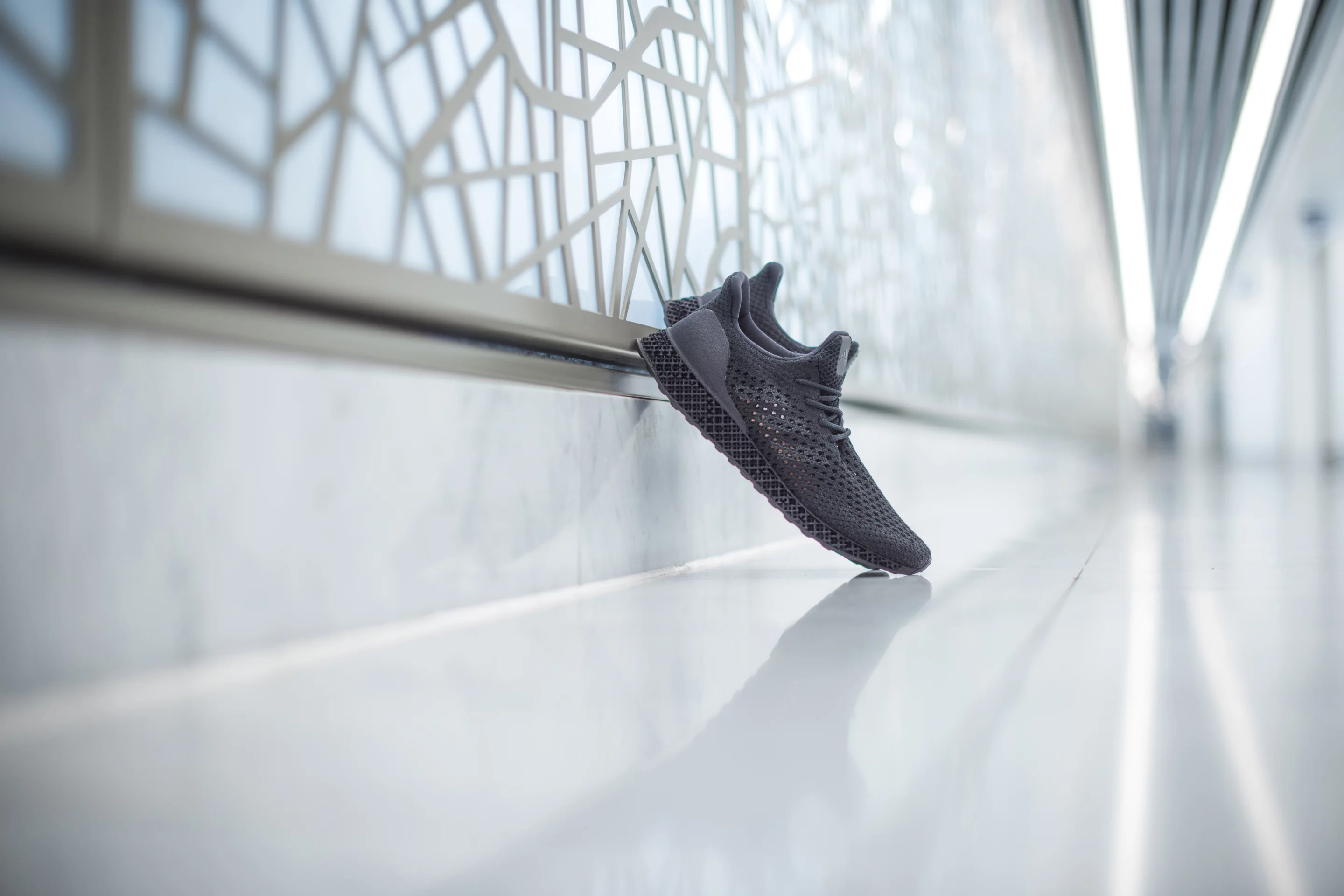 Adidas 3D Runner elegantly leaned up against a wall