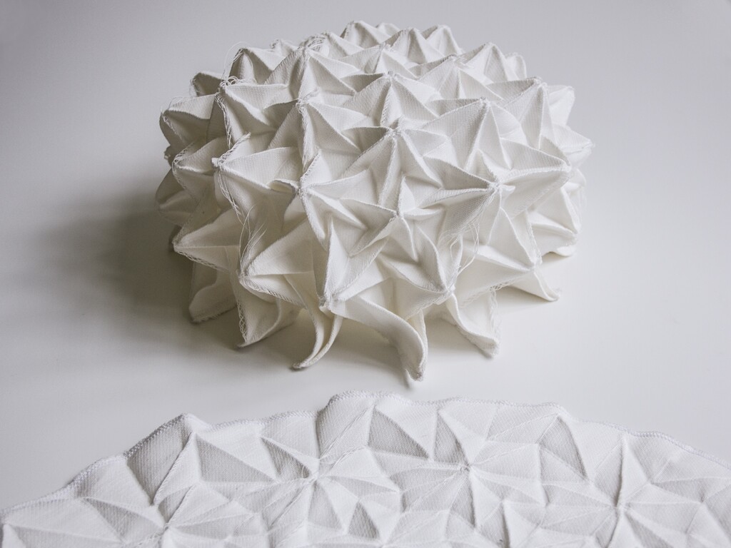 Studio Samira Boon has created a woven self supported origami dome from a single sheet of fabric and woven self supportive arc.