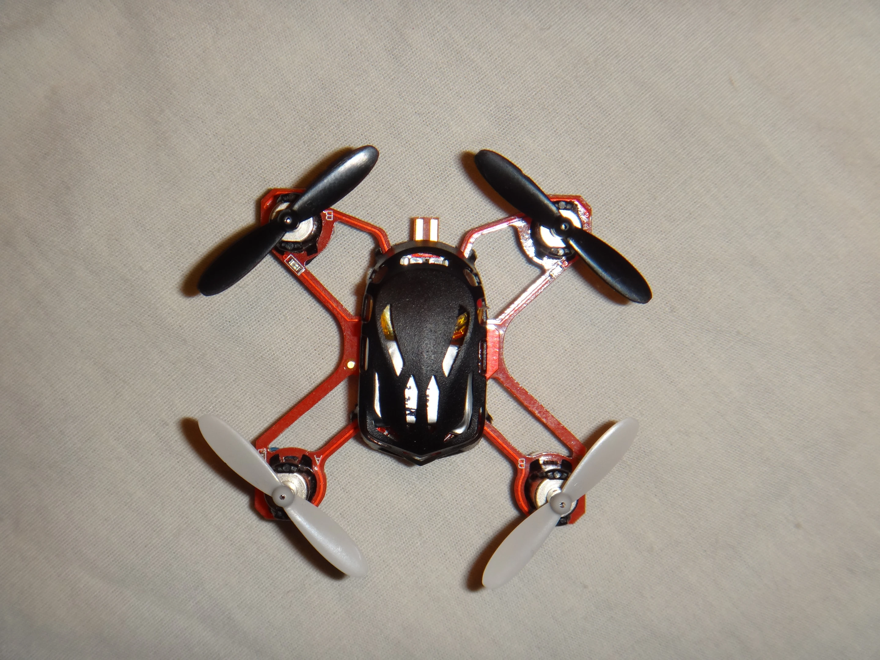 Measuring from the tip of the rotor blades, each of its fours sides is approximately 2.5 in (6.4 cm) long