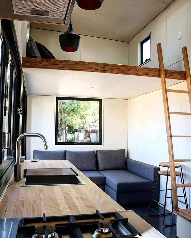 The Sowelo tiny house comfortably sleeps up to 6 guests and boasts two loft bedrooms