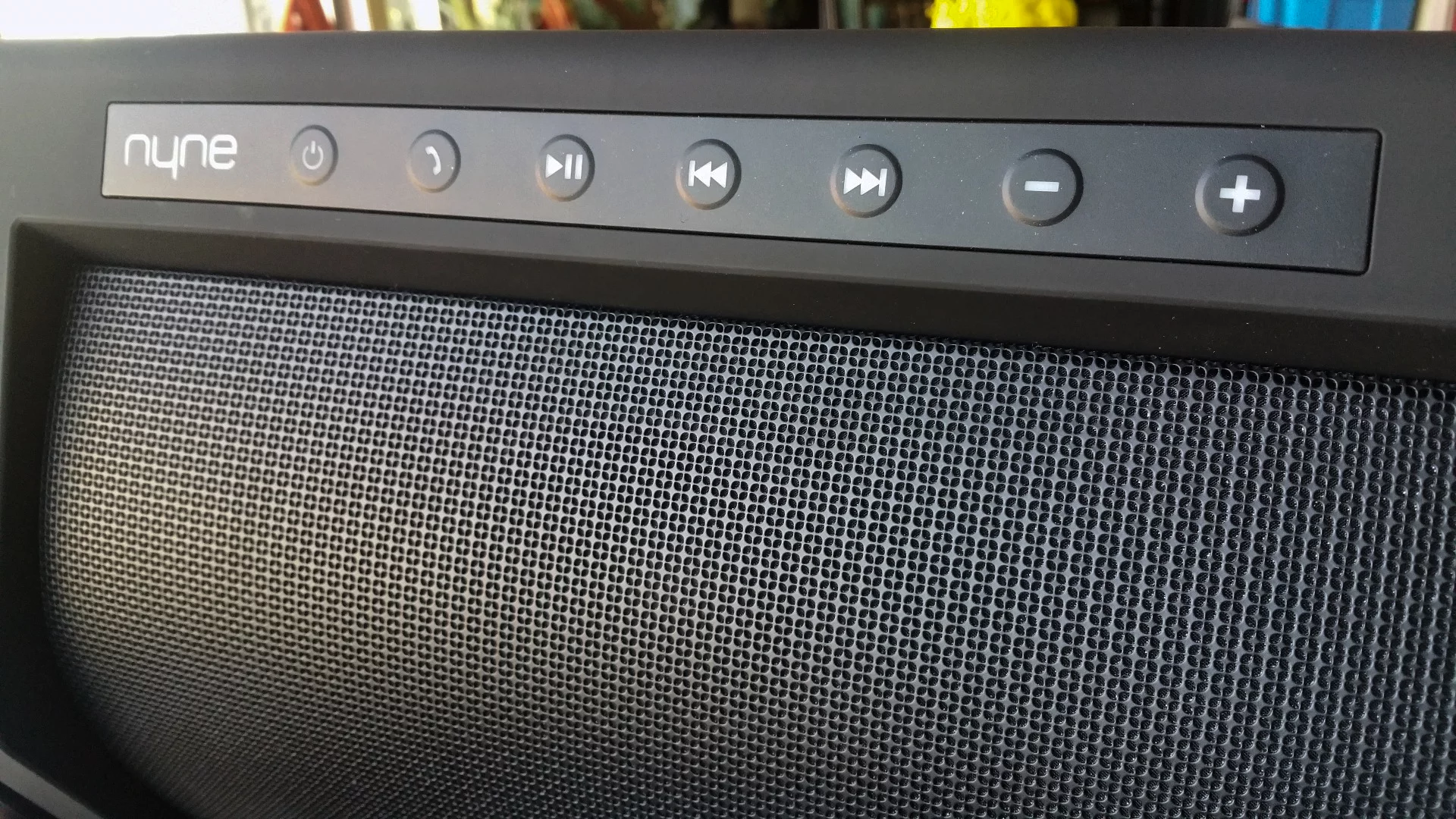 The Nyne Rock's controls are neatly arrayed across the top, glowing white while the speaker is on