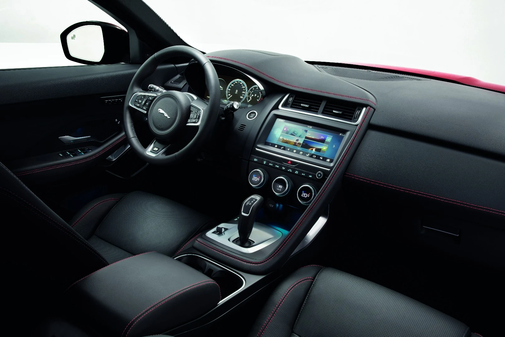 A passenger grab handle helps create a border for the driver area