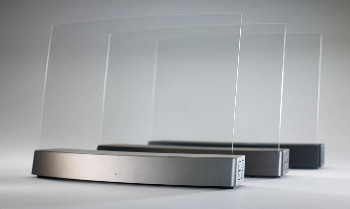 The Clio utilizes a 2-inch woofer and piezoelectric actuators in its base, which stimulate two thin membranes (one per channel) running along both sides of its transparent curved transducer