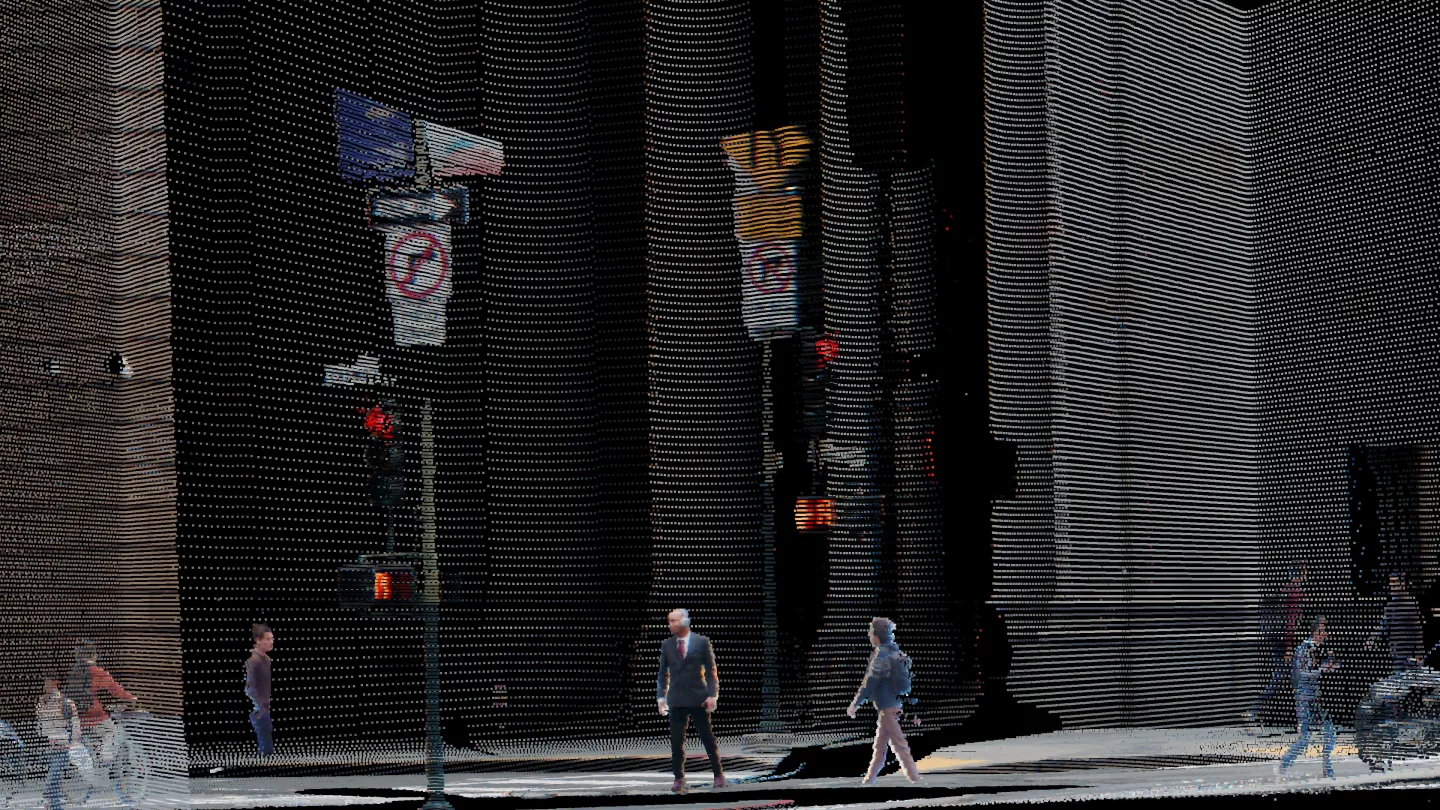 A city block as Rev8 sees it: pedestrians, traffic signals, and building facades rendered in a fully colored 3D point cloud