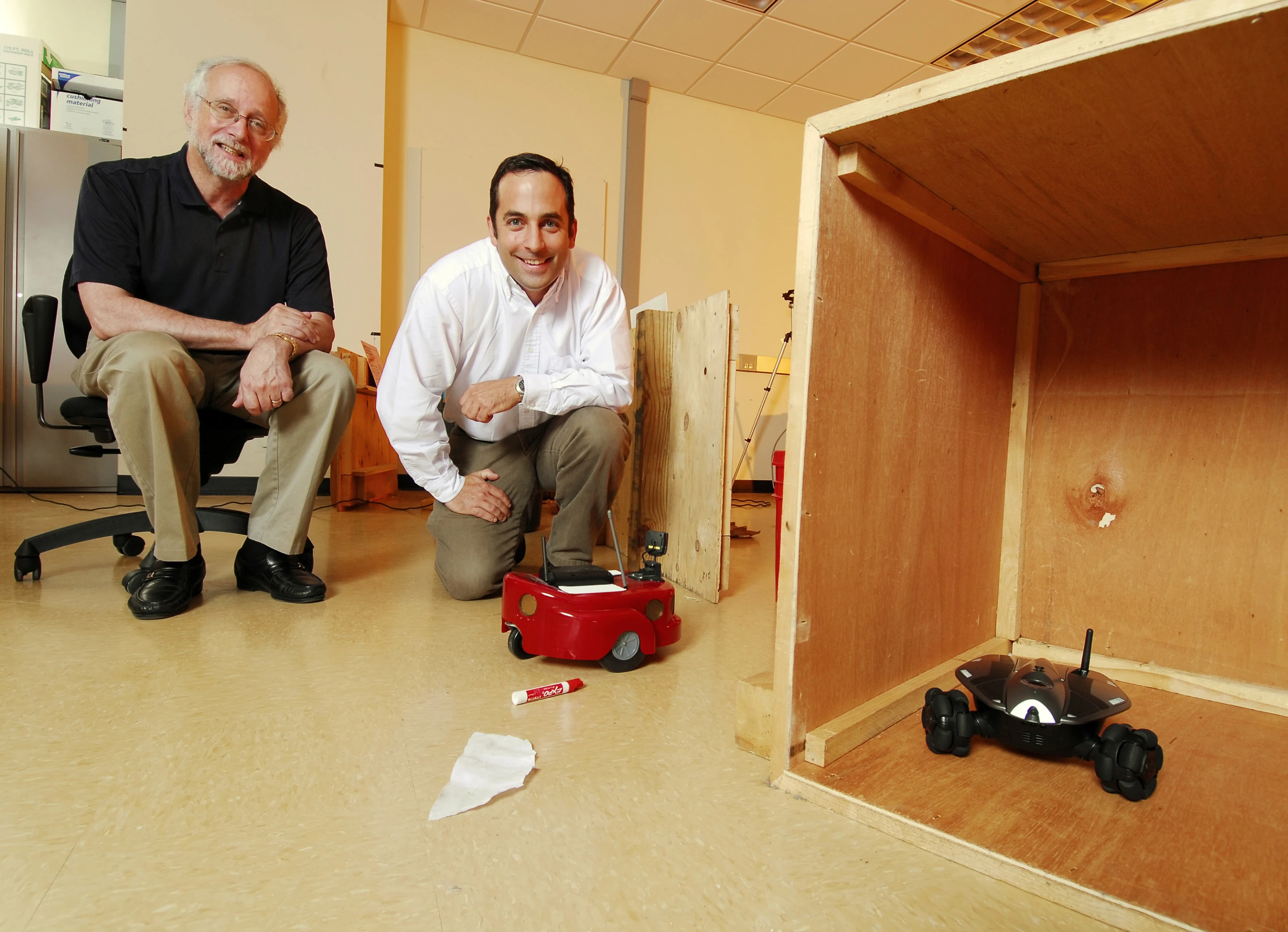 Prof. Ronald Arkin (left) and research engineer Alan Wagner with their hide-and-seek-playing robots
