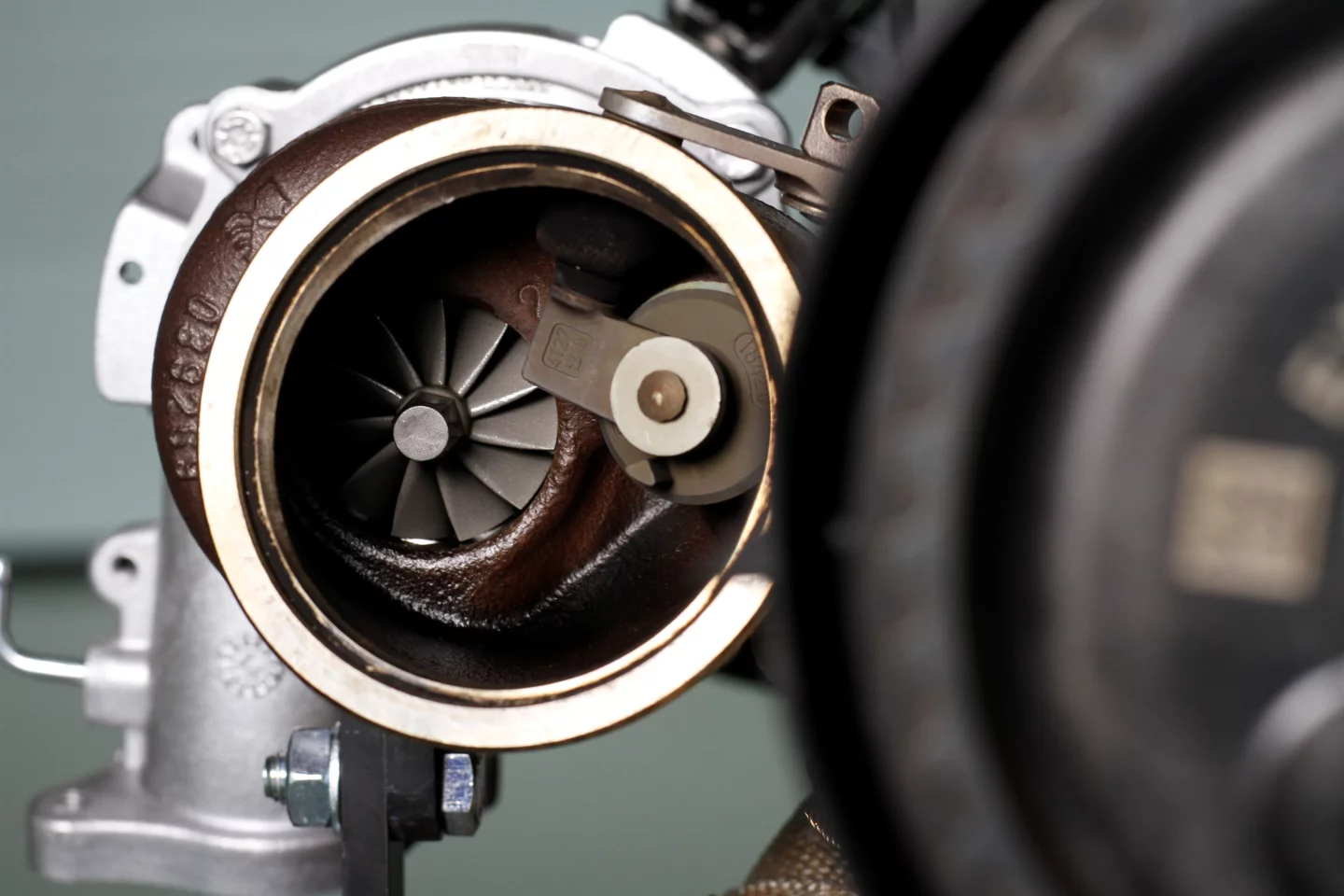 Ahead of the parallel twin turbochargers are two compressor units that "wind up" the impeller units prior to power coming online, thus eliminating turbo lag