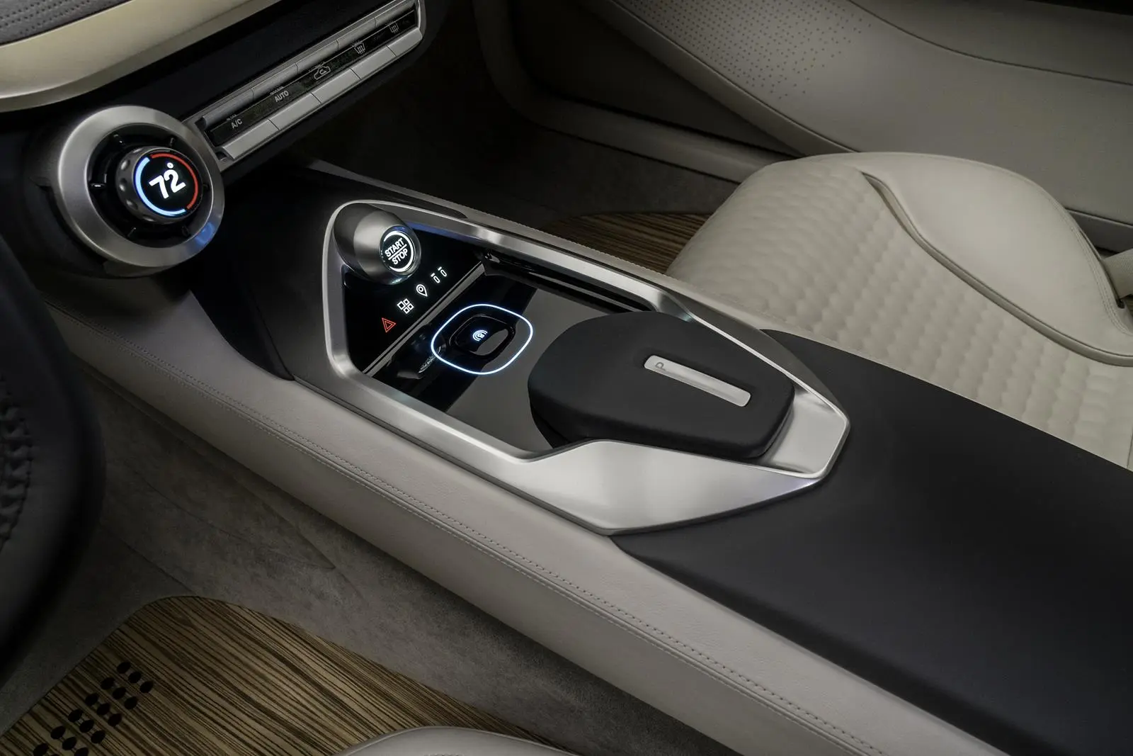A simple row of climate controls with a dial at left is at the center of the Vmotion 2.0 concept’s stack, below which a push-button start and gear selection are found