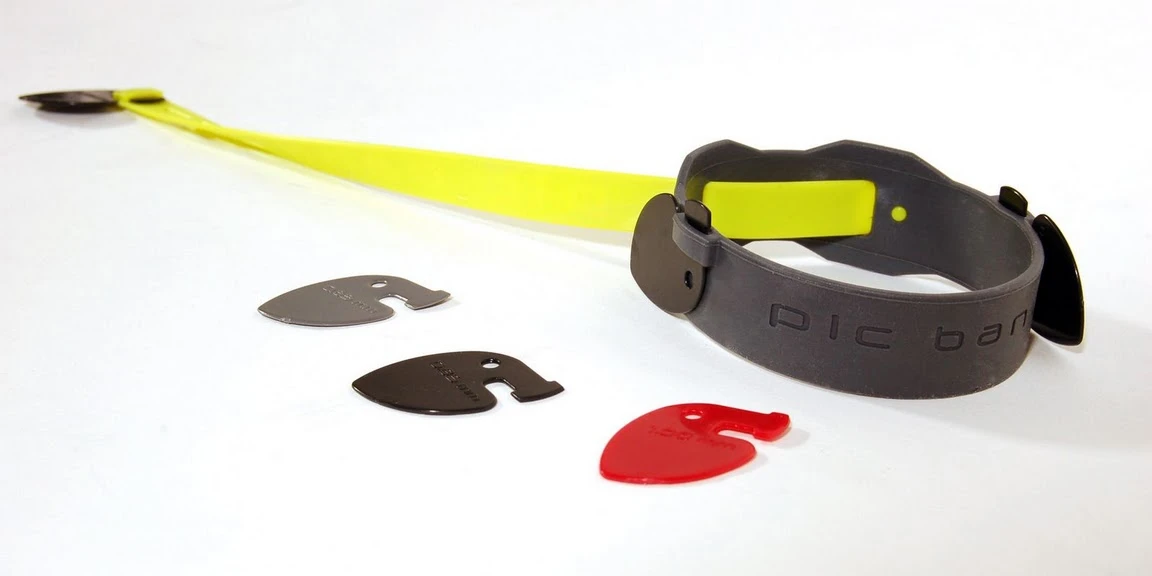 The PicBand system consists of an elastic wristband which has room for extra pick storage, three picks of varying thickness, and lanyard